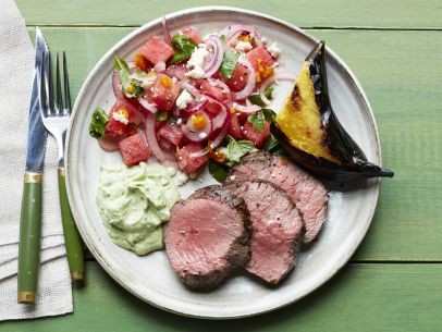 Beef tenderloin with basil crema, watermelon-basil salad, and grilled plantains