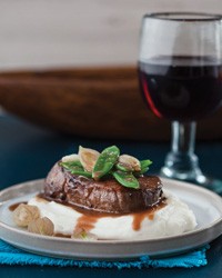 Beef tenderloin with cilantro-wine sauce and mashed yucca