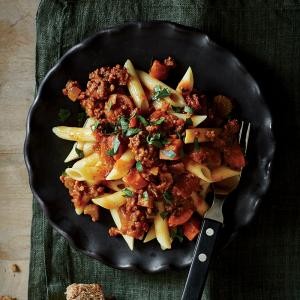 Beefy Bolognese over penne pasta