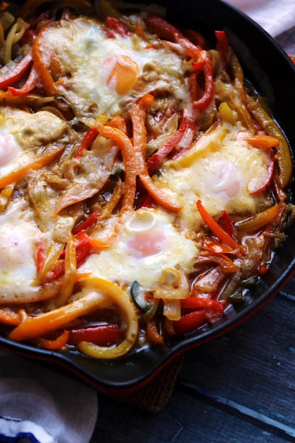 Beer-baked eggs with peppers and onions