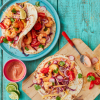 Beer-battered prawn tacos with chipotle mayo and mango slaw