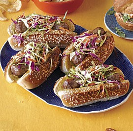 Beer-braised bratwursts with pickle juice slaw