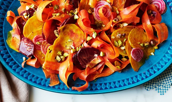 Beet and carrot salad with curry dressing and pistachios