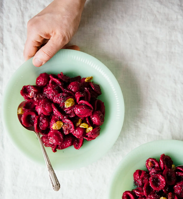 Beet-dressed pasta with golden raisins and poppy seeds