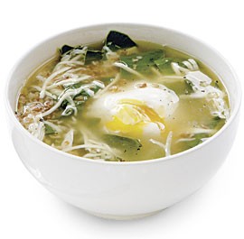 Beet green and bulgur soup with poached eggs