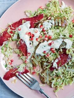 Beetroot-cured salmon, grilled artichokes, shredded cabbage, crème fraîche and pomegranate