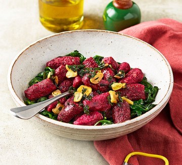 Beetroot gnocchi with crispy garlic & sage