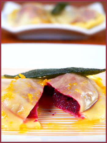 Beetroot ravioli and orange sauce