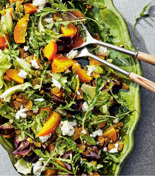 Beets and mixed greens salad with golden raisins and pistachios