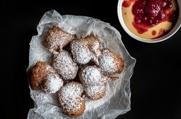 Beignets with custard and berries