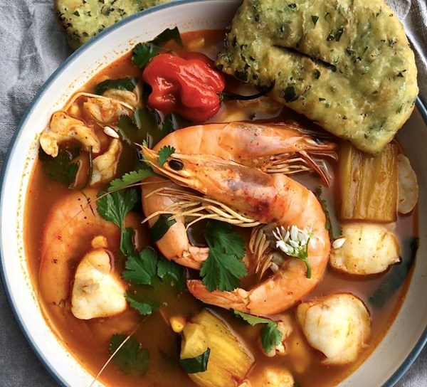 Belizean inspired fish soup with wild garlic fry jacks