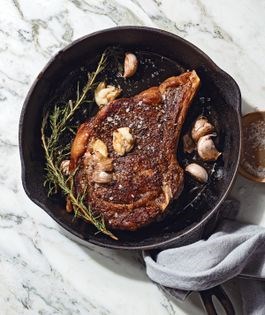 Belle's pan-seared ribeye steaks with rosemary and garlic, family-style