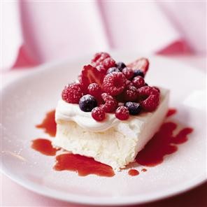 Berry Pavlova squares with Cointreau strawberry coulis