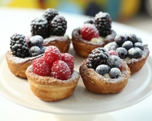 Berry tartlets with cream cheese frosting
