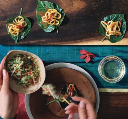 Betel leaf wraps with curried squid and cucumber relish