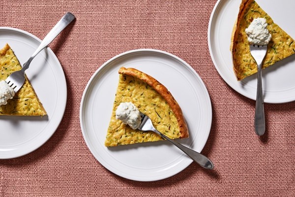 Big zucchini pancake with yogurt-feta sauce