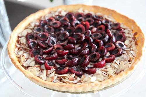 Bing cherry goat cheese corn flour tart with fresh ground black pepper