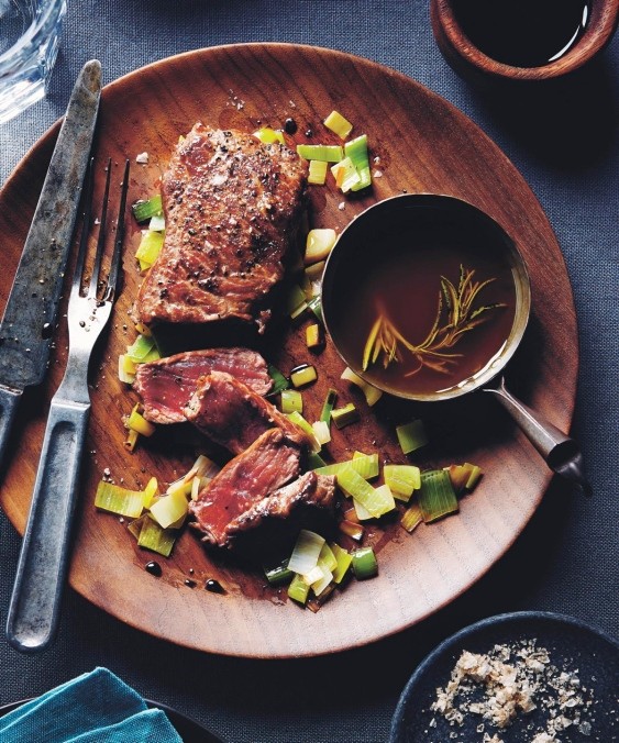 Bison steaks with rosemary oil & smoked salt on buttery leeks