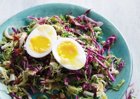 Bitter greens salad with bacon and mollet eggs