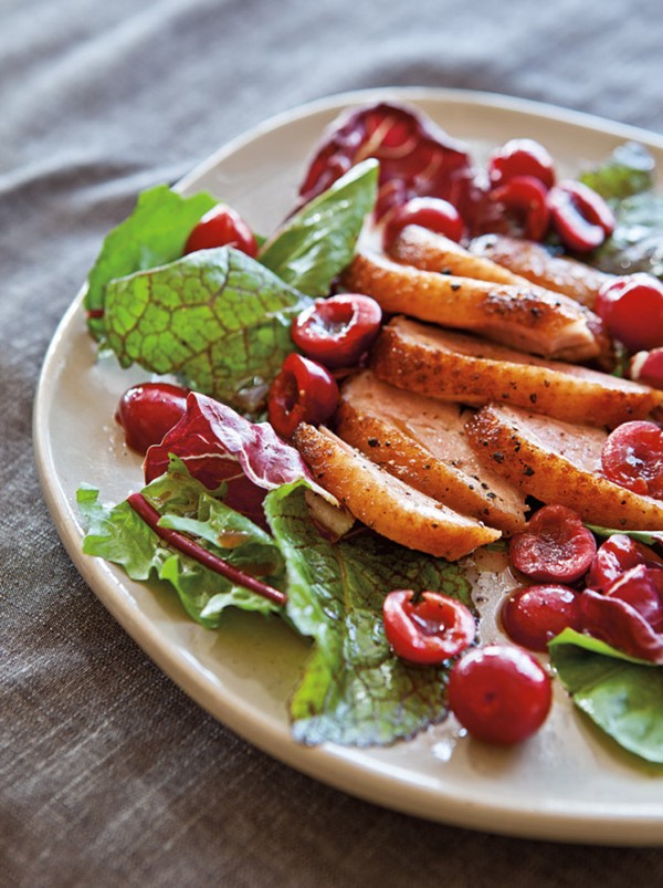 Bitter greens with duck breast & cherries