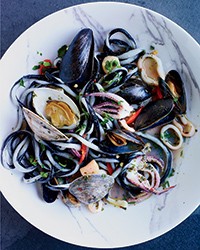 Black-and-white pici pasta with squid and shellfish