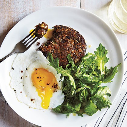 Black bean cakes with mixed greens and eggs