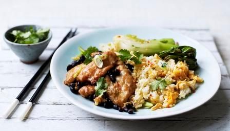 Black bean chicken with stir-fried rice and wilted bok choi