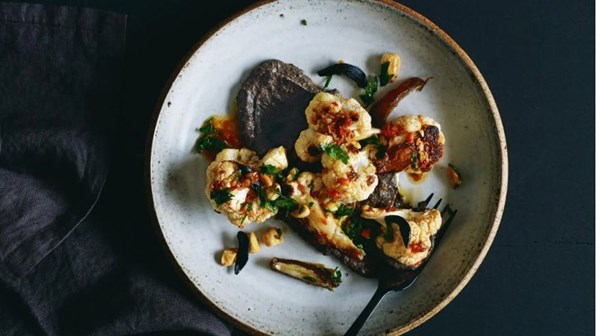 Black bean hummus with roasted cauliflower salad and black garlic harissa dressing