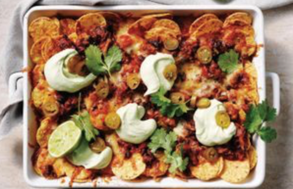 Black bean nachos with avocado sour cream and smoked scamorza