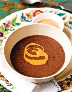 Black bean soup with hot roast pepper cream