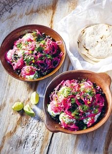 Black beans with coriander, pickled onions, and crema