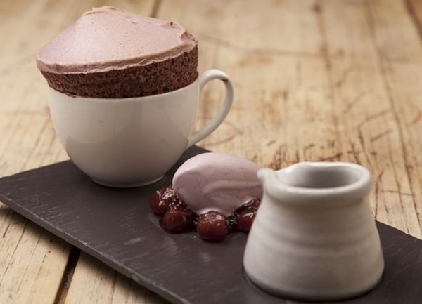Black cherry soufflé with cherry ice cream and chocolate sauce