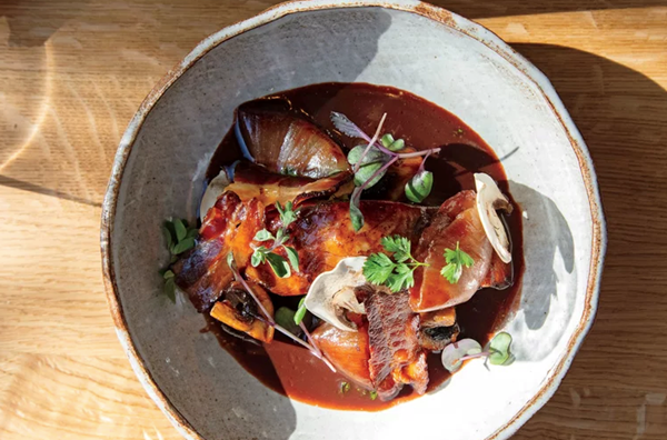 Black cod with mushrooms, bacon, and red wine sauce
