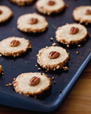 Black pepper cheese shortbread with pecan garnish