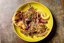 Black pepper-cumin chicken and onion traybake