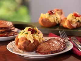 Black pepper popovers filled with herbed scrambled eggs and glazed Canadian bacon