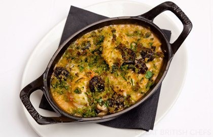 Black pudding, scampi and white bean crumble with wild garlic crust