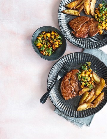 Black treacle glazed gammon steaks, crisp potato wedges and pineapple chutney