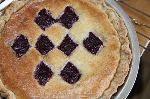 Blackberry lemon chess pie with almond scented crust and honey jumbleberry sauce