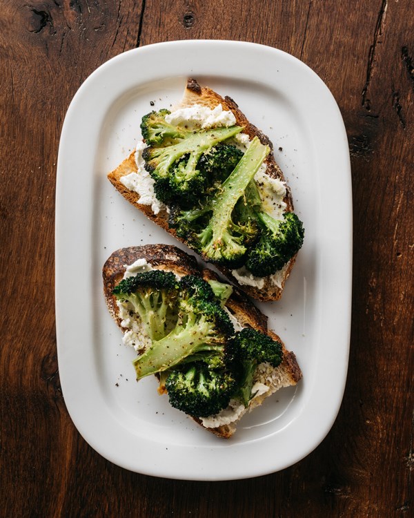 Blasted broccoli and goat cheese toasts with lemon zest