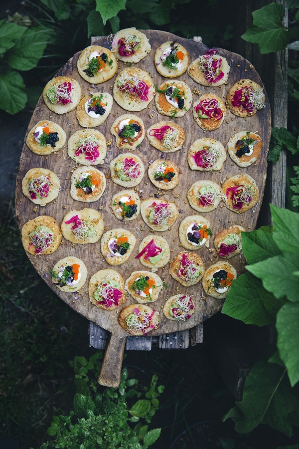 Blini with avocado cream and buckwheat crunch