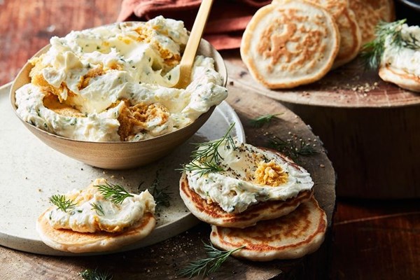 Blini with sea urchin cream cheese and dill