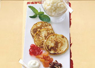 Blinis with tapioca caviar, candied fruits, toasted pecans, and crème fraîche