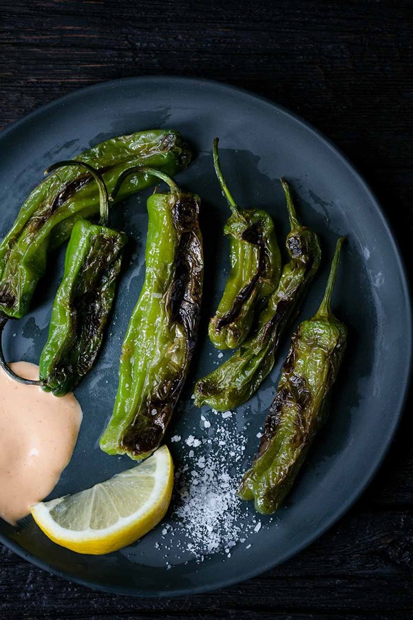 Blistered shishito peppers with Sriracha aioli