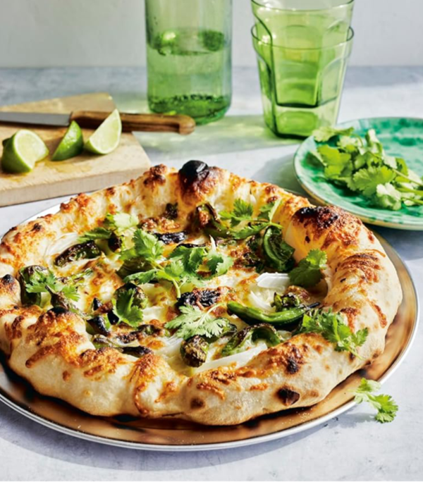 Blistered shishito pizza with onions and Monterey Jack