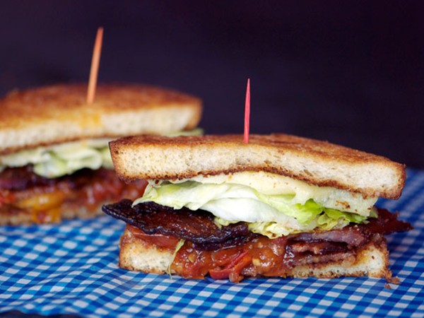 BLT sandwiches with candied bacon, lettuce, and tomato jam