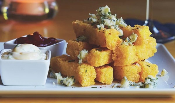 Blue cheese polenta fries with curry ketchup and garlic aioli [A'Town Bistro]