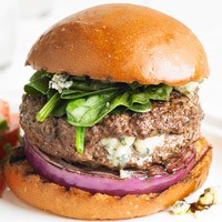 Blue cheese stuffed burger with red onion and spinach