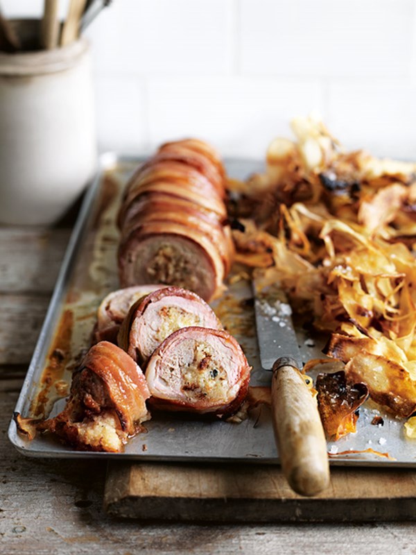Blue-cheese stuffed pork and bacon roast with sweet parsnip chips