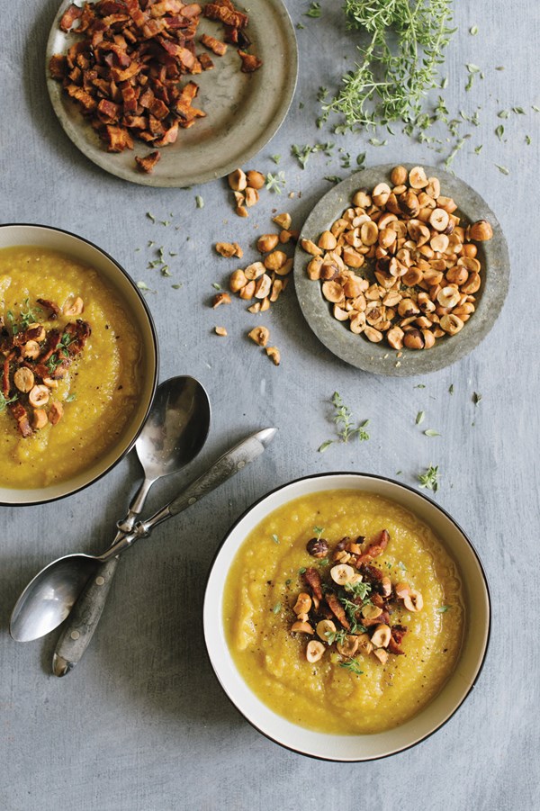 Blue Hubbard squash soup with crumbled bacon and toasted hazelnuts